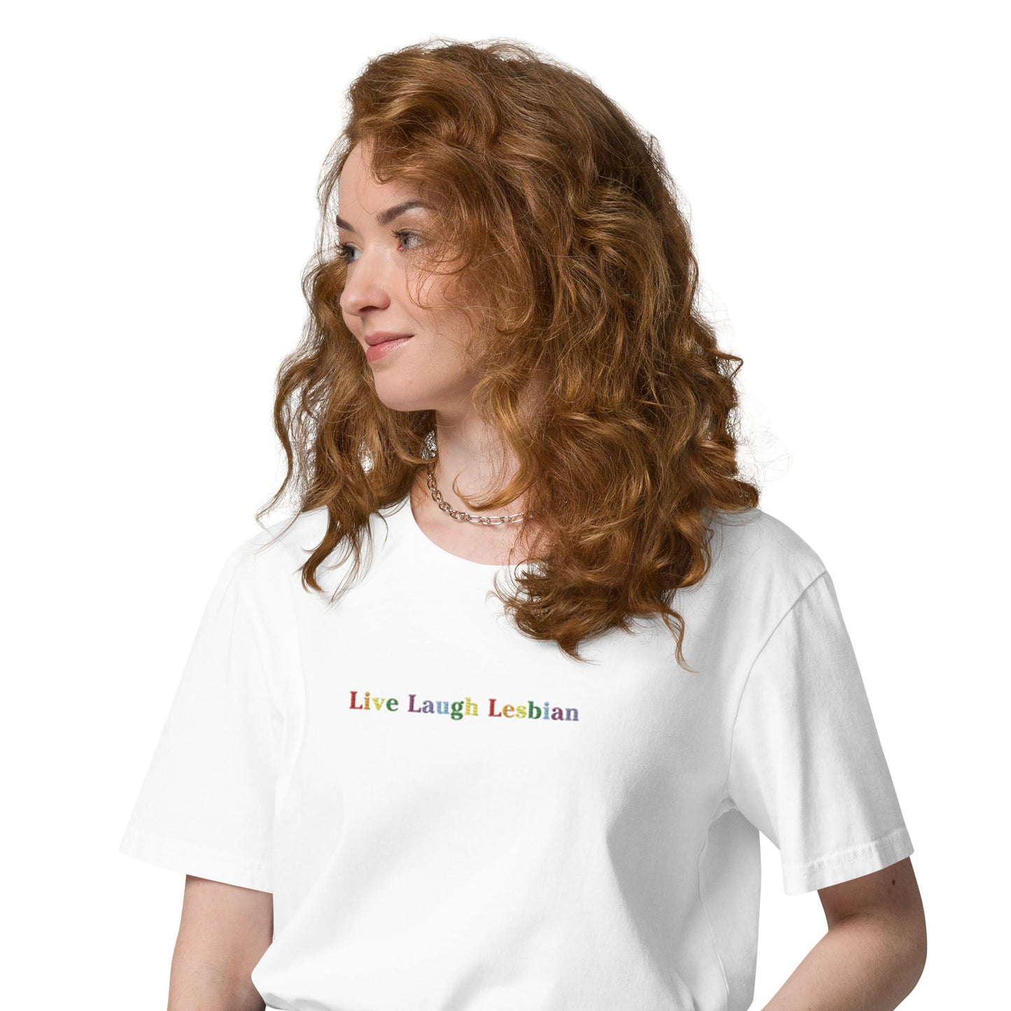 A woman in a white t-shirt with the words "Live Laugh Lesbian".
