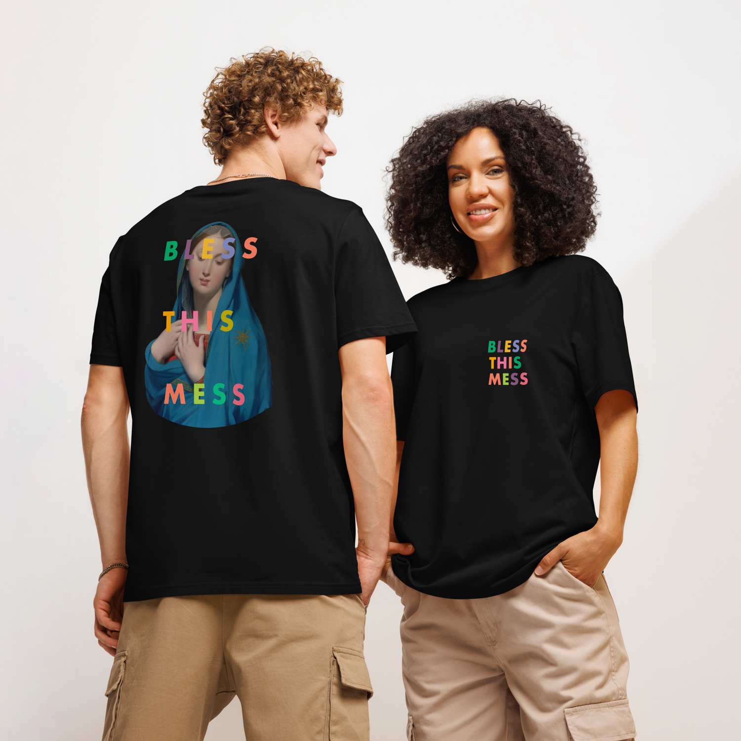 Lady on the beach wearing a white t-shirt with focus on the good embroidered onto it