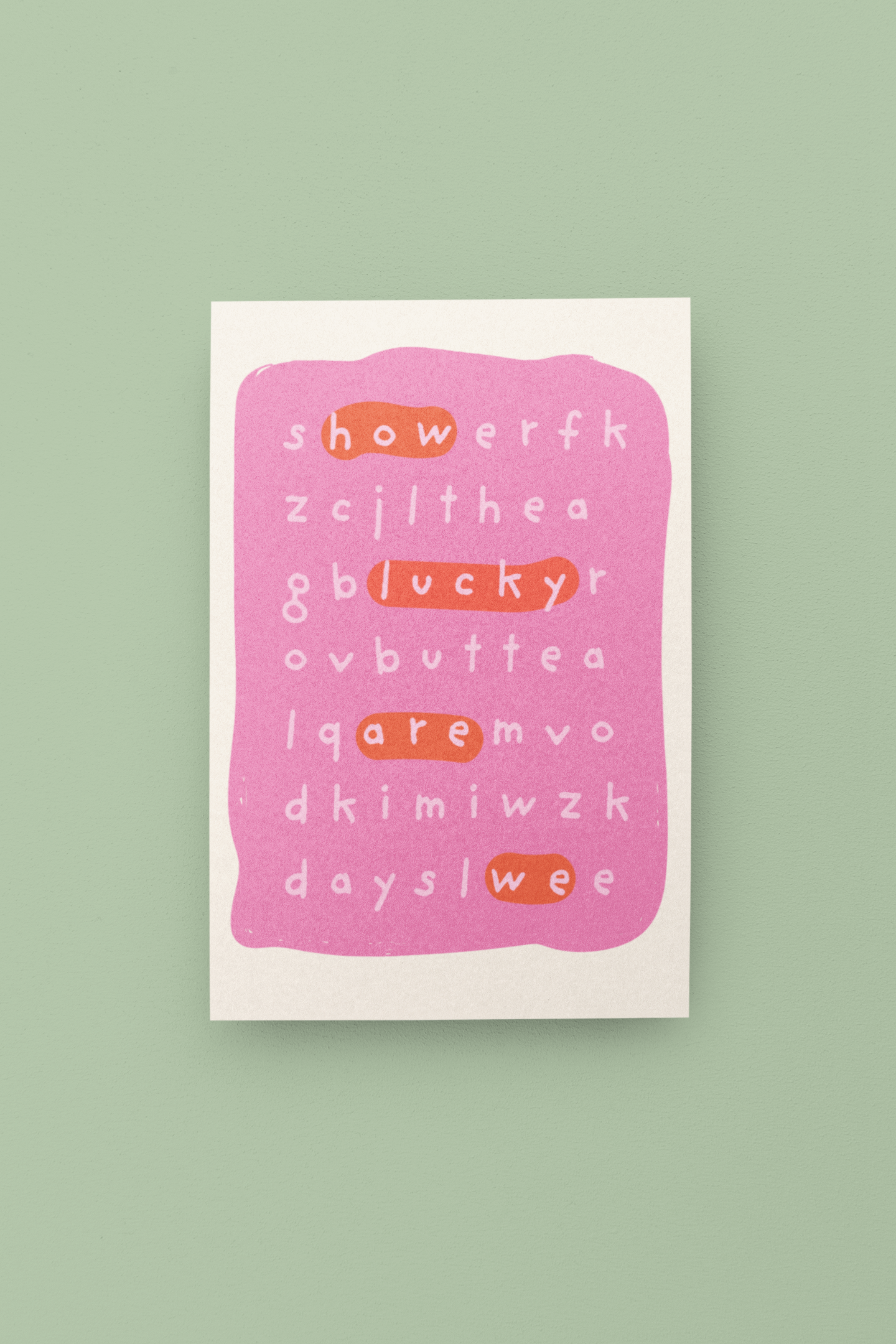Pink card with scrambled text on a green background